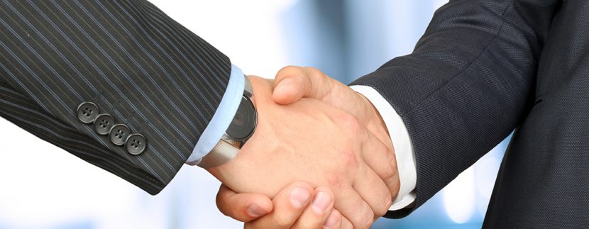 Motel Brokers Shaking Hands